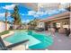 Stunning backyard oasis with a large swimming pool and a covered patio area at 10722 E Keats Ave, Mesa, AZ 85209
