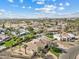 Aerial view of a residential area featuring homes, pools, and lush green landscaping at 11420 N 50Th St, Scottsdale, AZ 85254