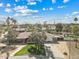 Aerial view of a suburban home with a pool, large backyard, and mature trees in a quiet neighborhood setting at 11420 N 50Th St, Scottsdale, AZ 85254