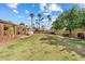 Backyard features a grass area, volleyball net and trees at 11420 N 50Th St, Scottsdale, AZ 85254