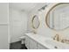 Updated bathroom featuring double sinks, a modern vanity, and sleek gold fixtures at 11420 N 50Th St, Scottsdale, AZ 85254