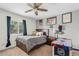 Comfortable bedroom featuring a ceiling fan, natural light, and space for entertainment at 11420 N 50Th St, Scottsdale, AZ 85254