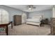 Bedroom featuring neutral walls, ceiling fan and wide window with shuttered blinds at 11420 N 50Th St, Scottsdale, AZ 85254