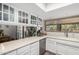 Kitchen featuring white cabinets, stainless appliances, and a breakfast bar at 11420 N 50Th St, Scottsdale, AZ 85254