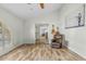 Inviting living room with wood floors, a vaulted ceiling, and plentiful natural light at 11420 N 50Th St, Scottsdale, AZ 85254