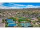 Scenic aerial view of community tennis courts with mountain views and lush landscaping at 11554 W Lone Tree Trl, Peoria, AZ 85383