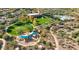 Aerial view of community amenities, including a pool, playground, and park area for residents at 11554 W Lone Tree Trl, Peoria, AZ 85383