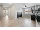 Minimal bedroom featuring light tile floors, neutral walls, and bright natural light at 11554 W Lone Tree Trl, Peoria, AZ 85383