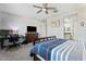 Comfortable bedroom with a ceiling fan, carpet, and an ensuite bathroom at 11554 W Lone Tree Trl, Peoria, AZ 85383