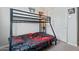 bedroom featuring a black bunkbed and gaming decor at 11554 W Lone Tree Trl, Peoria, AZ 85383