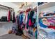 Walk-in closet with ample storage space, shelving, and organized clothing at 11554 W Lone Tree Trl, Peoria, AZ 85383