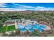 Aerial view of the community pool complex with multiple pools, lounge areas, and landscaping at 11554 W Lone Tree Trl, Peoria, AZ 85383