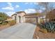 Attractive one-story home featuring a 2-car garage and well-kept front yard landscaping at 11554 W Lone Tree Trl, Peoria, AZ 85383