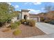 Inviting single-story home featuring a two-car garage and tidy desert landscaping at 11554 W Lone Tree Trl, Peoria, AZ 85383