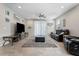 Spacious living room with tile flooring, a ceiling fan, and comfortable seating, creating a cozy atmosphere at 11554 W Lone Tree Trl, Peoria, AZ 85383