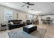 Spacious living room connected to kitchen with tile floors and comfortable seating at 11554 W Lone Tree Trl, Peoria, AZ 85383