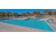 Beautiful outdoor pool with clear water and ample lounge seating, perfect for relaxation and recreation at 11554 W Lone Tree Trl, Peoria, AZ 85383