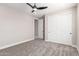 Bedroom featuring neutral walls, carpet floors, ceiling fan, and a sliding door closet at 13012 S 218Th Ave, Buckeye, AZ 85326
