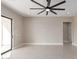 Expansive bedroom with a sliding glass door, tile floors, recessed lighting, and neutral walls at 13012 S 218Th Ave, Buckeye, AZ 85326