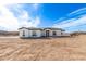 Stunning single-story home featuring a modern design, desert landscaping, and a spacious front yard at 13012 S 218Th Ave, Buckeye, AZ 85326