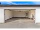 Spacious garage with high ceilings, a water heater, and ample room for storage at 13012 S 218Th Ave, Buckeye, AZ 85326