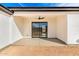 A covered patio with a ceiling fan and sliding glass door at 13012 S 218Th Ave, Buckeye, AZ 85326