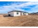 The rear of the property is a modern stucco home with a tile roof and desert landscaping at 13012 S 218Th Ave, Buckeye, AZ 85326