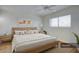 Serene bedroom showcasing a light-filled space, a large window, and modern decor at 1320 E Bethany Home Rd # 24, Phoenix, AZ 85014