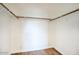 Walk-in closet with wood-look floors, white paint, and wood bars at 1320 E Bethany Home Rd # 24, Phoenix, AZ 85014