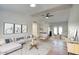 Bright living room featuring vaulted ceilings, modern decor, neutral color palette, and wood flooring at 1320 E Bethany Home Rd # 24, Phoenix, AZ 85014
