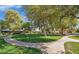 Well-maintained community park with grassy areas, mature trees, walking paths, and a tranquil atmosphere at 1320 E Bethany Home Rd # 24, Phoenix, AZ 85014