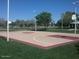 Outdoor basketball court in community with greenery, sky, trees and streetlamps at 1321 W Shellfish Dr, Gilbert, AZ 85233