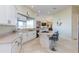 Bright kitchen features white cabinetry, granite countertops, and a center island with bar seating at 15128 E Westridge Dr, Fountain Hills, AZ 85268