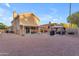 Home's backyard features a desert landscape, covered patio and gazebo with outdoor grill and seating at 16002 N 50Th St, Scottsdale, AZ 85254