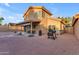 Outdoor living is easy in this backyard featuring a covered patio, barbecue grill and well-maintained desert landscaping at 16002 N 50Th St, Scottsdale, AZ 85254