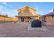 Backyard featuring outdoor kitchen, desert landscaping, grill, seating area, and covered patio at 16002 N 50Th St, Scottsdale, AZ 85254