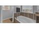 A luxurious bathroom with a soaking tub and designer tile accents at 16002 N 50Th St, Scottsdale, AZ 85254