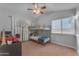 ' bedroom with bunk beds, a ceiling fan, and a large window at 16002 N 50Th St, Scottsdale, AZ 85254