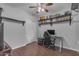 Bedroom with hardwood floors, a modern desk, shelves and closet at 16002 N 50Th St, Scottsdale, AZ 85254