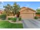 Charming home with a well-manicured lawn, mature trees, and a two-car garage at 16002 N 50Th St, Scottsdale, AZ 85254
