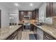 Beautiful kitchen with a center island, granite countertops, stainless steel appliances at 16002 N 50Th St, Scottsdale, AZ 85254