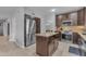 Well-equipped kitchen with stainless steel appliances and a center island for food preparation at 16002 N 50Th St, Scottsdale, AZ 85254