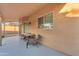 Covered patio area with furniture, desert landscaping, with a gazebo and grill area at 16002 N 50Th St, Scottsdale, AZ 85254