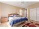 Bedroom features tiled floor and a closet with sliding doors at 16528 W Isleta Ct, Surprise, AZ 85387