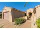 Inviting home exterior featuring a private courtyard and well-maintained landscaping at 16528 W Isleta Ct, Surprise, AZ 85387