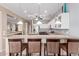 Kitchen featuring granite countertops, bar seating and stainless steel appliances at 16528 W Isleta Ct, Surprise, AZ 85387