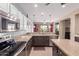 Kitchen featuring granite countertops, stainless steel appliances and modern fixtures at 16528 W Isleta Ct, Surprise, AZ 85387