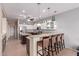 Eat-in kitchen featuring granite countertops, bar seating and stainless steel appliances at 16528 W Isleta Ct, Surprise, AZ 85387