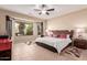 Neutral main bedroom with a large bay window to backyard view at 16528 W Isleta Ct, Surprise, AZ 85387