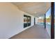 Covered back patio with view of pool, access from sliding glass door, and white brick exterior at 1716 W Butler Dr, Phoenix, AZ 85021